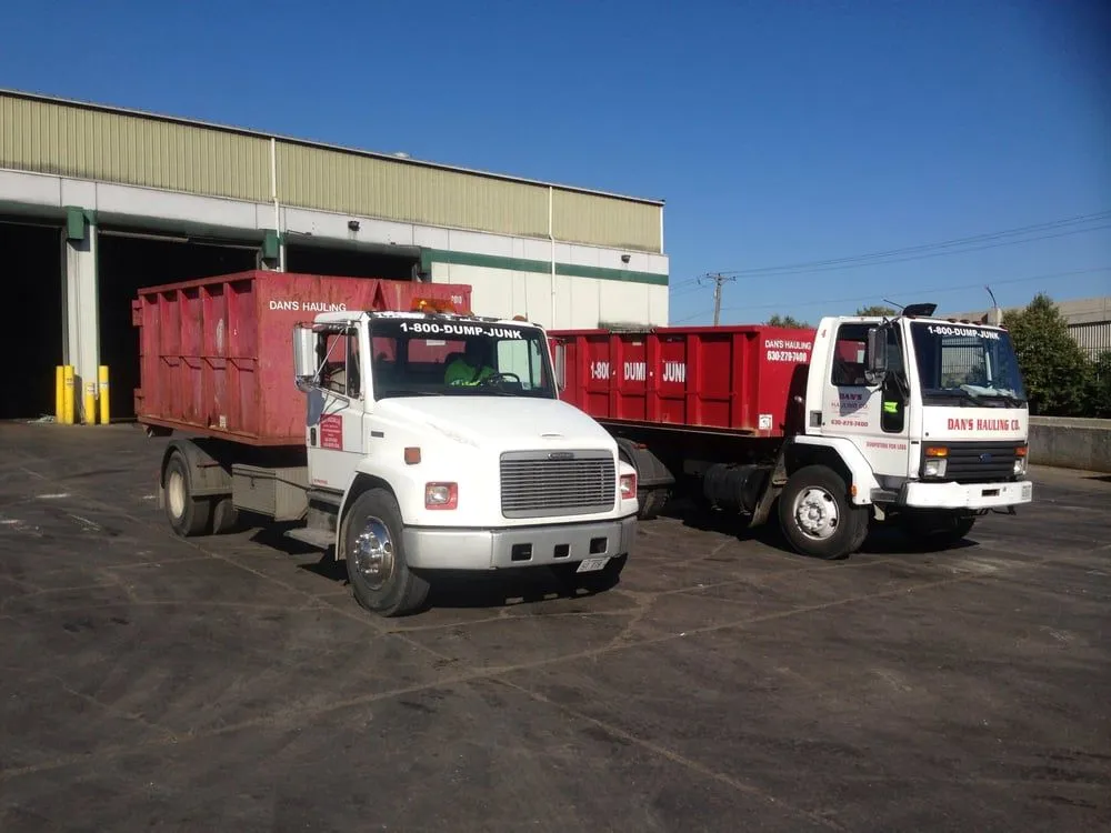 Two Dan's Hauling trucks at the yard